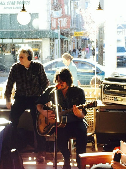 Guitarist-singer Patrick Main entertains the crowd during Peet’s neighborhood party