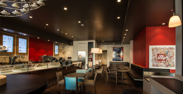 Red walls and modern furniture welcome you.