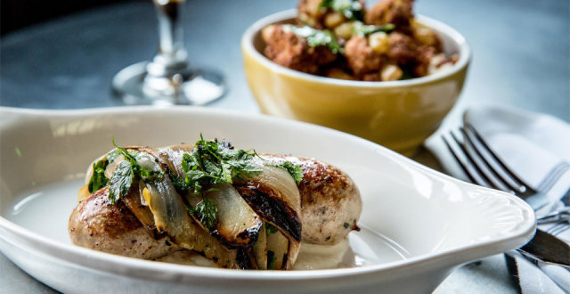 House-made sausages come from Belga’s wood-fired grill.
