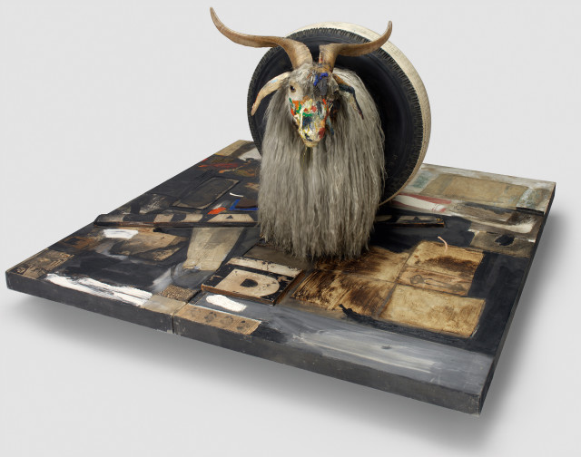 Robert Rauschenberg, Monogram, 1955–59; oil, paper, fabric, printed paper, printed reproductions, metal, wood, rubber shoe heel, and tennis ball on canvas with oil and rubber tire on Angora goat on wood platform mounted on four casters. Image: Moderna Museet, Stockholm, purchase 1965 with contribution from Moderna Museets Vänner/The Friends of Moderna Museet;© Robert Rauschenberg Foundation