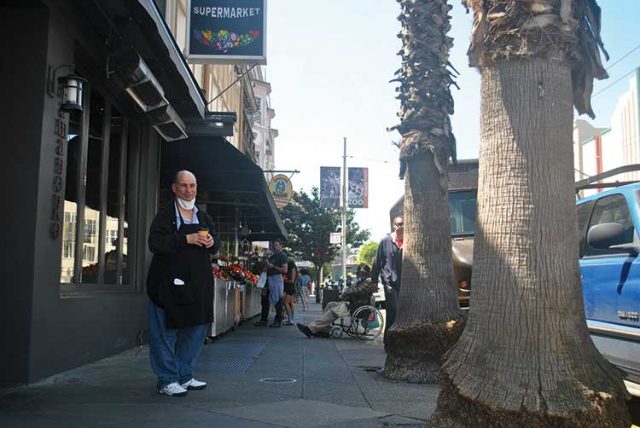 A rock in the community for nearly 50 years, Bob Farina, affectionately known as “Broadway Bob,” takes a quick break from serving customers at the Marina Supermarket.