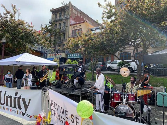 Musicians Ricardo Scales and Ensemble perform at a unity-themed concert at Portsmouth Square. photo: Anh Lê