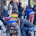 People gather on the streets of the Tenderloin to buy, sell and use drugs just blocks from the Tenderloin Linkage Center.